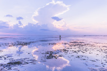 Reflection Of Fisherman In Bali At Sunrise