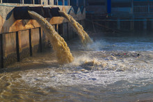 Industrial And Factory Waste Water Discharge Pipe Into The Canal And Sea, Water Pollution