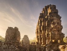 Day View Of Ancient Temple Bayon Angkor With Stone Faces Siem Reap, Cambodia