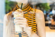 Close-up Of Teenage Girl Drinking A Milk Shake