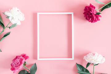 Wall Mural - minimal flowers composition. blank frame for text, beautiful peonies flowers on pastel pink backgrou