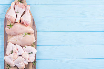 Wall Mural - Raw chicken meat on wooden background