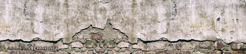 Panorama old damaged brick wall with shabby plaster.