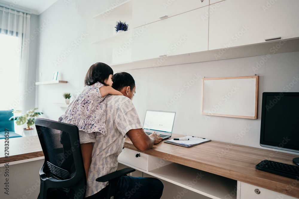 young business man parent interrupts by her daughter while working in the office