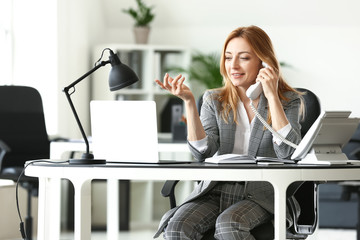 Poster - portrait of mature businesswoman working in office