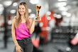 © fotofabrika - Half-length portrait of happy businesswoman keeping golden cup, isolated
