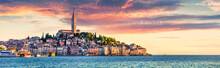 Great Spring Sunset Of Rovinj Town, Croatian Fishing Port On The West Coast Of The Istrian Peninsula. Colorful Evening Seascape Of Adriatic Sea. Traveling Concept Background.