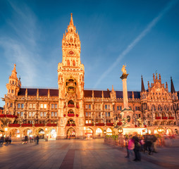 Poster - Impressive evening view of Marienplatz - City-center square & transport hub with towering St. Peter's church, two town halls and a toy museum, Munich, Bavaria, Germany, Europe.