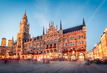 Great evening view of Marienplatz - City-center square & transport hub with towering St. Peter's church, two town halls and a toy museum, Munich, Bavaria, Germany, Europe.