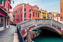 Beautiful Spring View Of Vennice With Famous Water Canal And Colorful Houses. Splendid Morning Scene In Italy, Europe. Magnificent Mediterranean Cityscape. Traveling Concept Background.