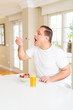 © Krakenimages.com - Middle age senior man eating cereals as healthy breakfast