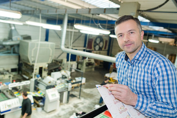 man working in printing factory