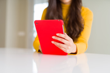 Wall Mural - Beautiful young woman working using touchpad tablet