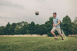 © sergign - Young man kicking a football during training