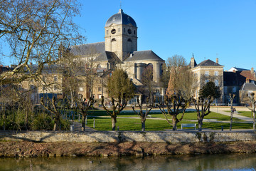 Wall Mural - The river Sarthe with the basilica Notre Dame at Alençon of the Lower Normandy region in France