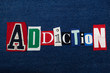 ADDICTION text word collage, colorful fabric on blue denim, abuse and treatment concept, horizontal aspect