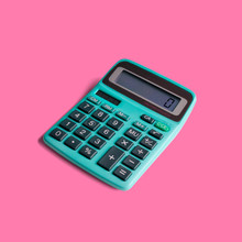 Vintage Pocket Calculator, With Both Battery And Solar Power, And Math Operations Limited To Multiplication, Division, Addition, Subtraction And Square Root. Isolated On A Punchy Pastel Background