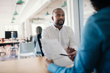 Smiling job applicant answering questions during a job interview