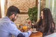 Young couple smiling in a cafe. Young man and woman in a restaurant.