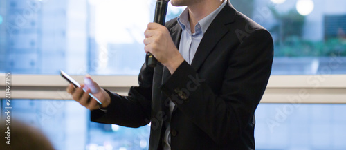 Cuadros en Lienzo Speaker holding microphone in conference