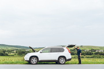 Wall Mural - man with broken car at road side