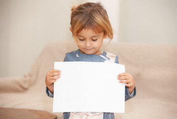 happy girl with white sheet in hands