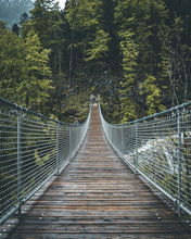 Suspension Bridge At Berchtesgaden Wit Green Trees