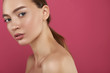 © Yakobchuk Olena - Charming girl with natural makeup standing against pink background