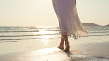 Young Asian Woman Walking On Beach. Beautiful Female Happy Relax Walking On Beach Near Sea When Sunset In Evening. Lifestyle Women Travel On Beach Concept.
