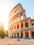 Colosseum, or Coliseum. Morning sunrise at huge Roman amphitheatre, Rome, Italy.