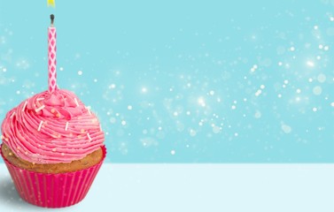 Canvas Print - Pink Cupcake with pink Candle on desk