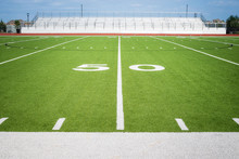 50 Yard Line On Empty American Football Field Stadium In Texas