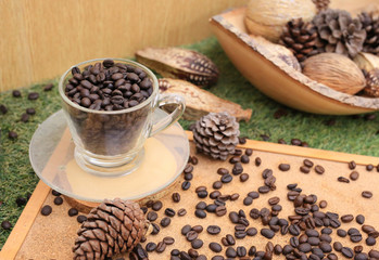 Coffee background with a decorative. Cup with coffee beans.