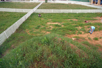 two surveyors measuring land