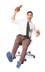 Poster - Happy accountant with pineapple and cocktail sitting on chair and dreaming about vacation against white background