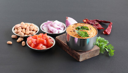 Wall Mural - Onion and tomato chutney, a healthy Indian vegetarian side dish for items like chapati, roti, idli and dosa, with its main ingredients.