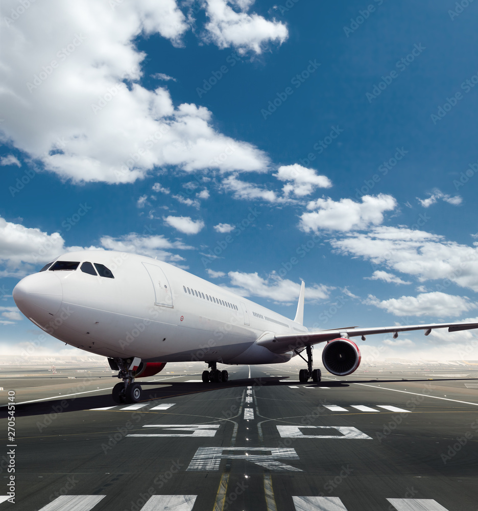 Front view of commercial airplane on runway - obrazy, fototapety, plakaty 