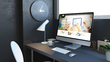 computer with ux design website at navy desktop