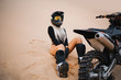 © UnPinky - Woman with long white hair sitting near cross dirt motorcycle in desert. Girl are resting during off-road tour at hot desert