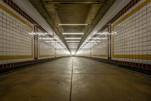 Long Connecting Hallway With Colorful Tiles In An Underground Subway Station