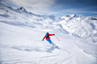Young attractive skier skiing in famous ski resort in Alps, Livigno, Italy, Europe