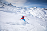 Young attractive skier skiing in famous ski resort in Alps, Livigno, Italy, Europe