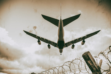 Poster - Giant aircraft landing at the airport. Skyward view