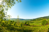 Fototapeta Na ścianę - beautiful mountain valleys and mountains on a bright sunny day on the background of a wide valley