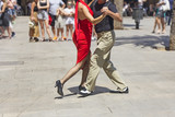 Street couple dancers performing Argentine tango dance