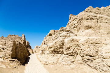 Wall Mural - Jiaohe Ruins, warehouse district, Turpan, China. Ancient capital of the Jushi kingdom, it was a natural fortress atop a steep cliff leaf-shaped plateau between two river valleys