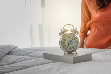 Background textures of Beautiful of Woman wake up on morning and sitting in the bedroom. 