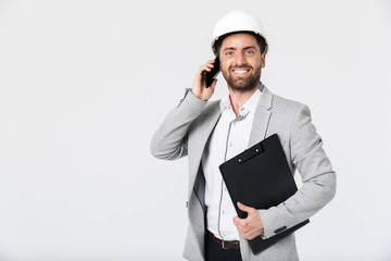 Confident bearded man builder wearing suit