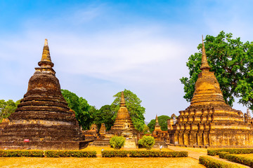 Sukhothai Wat Mahathat Buddha statues at Wat Mahathat ancient capital of Sukhothai, Thailand. Sukhothai Historical Park is the UNESCO world heritage