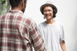 © SVRSLYIMAGES - young asian male hand shake with friend as foreground, young asian man with glasses handshake with black man